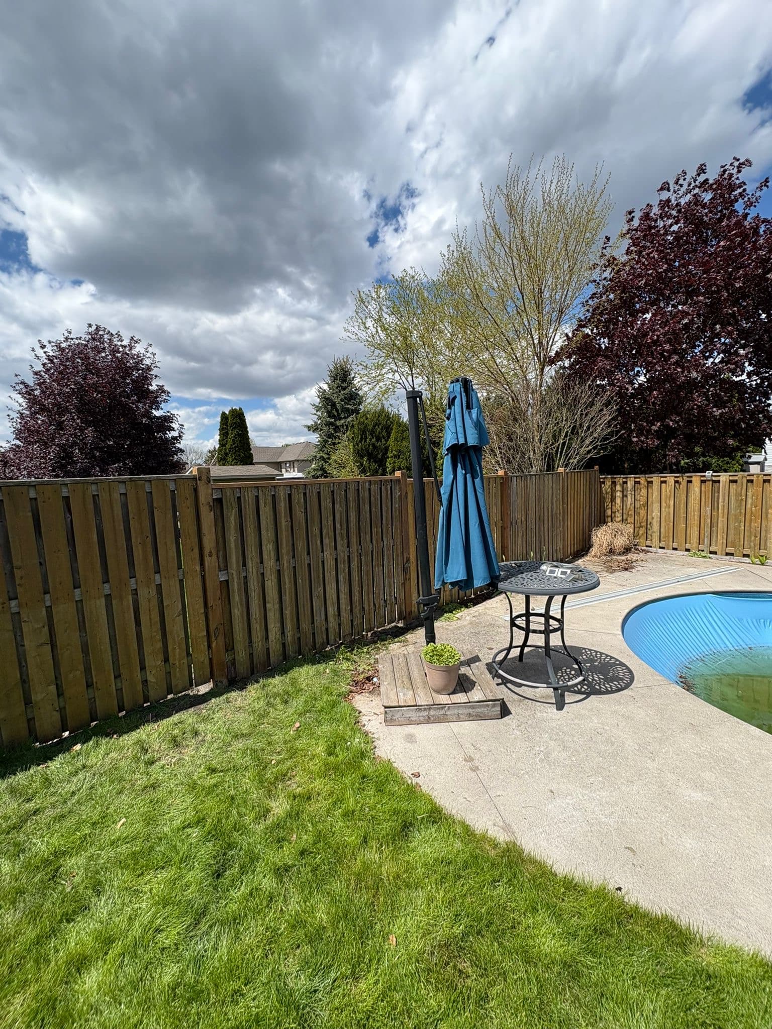 Aged wood fence with pool area restoration