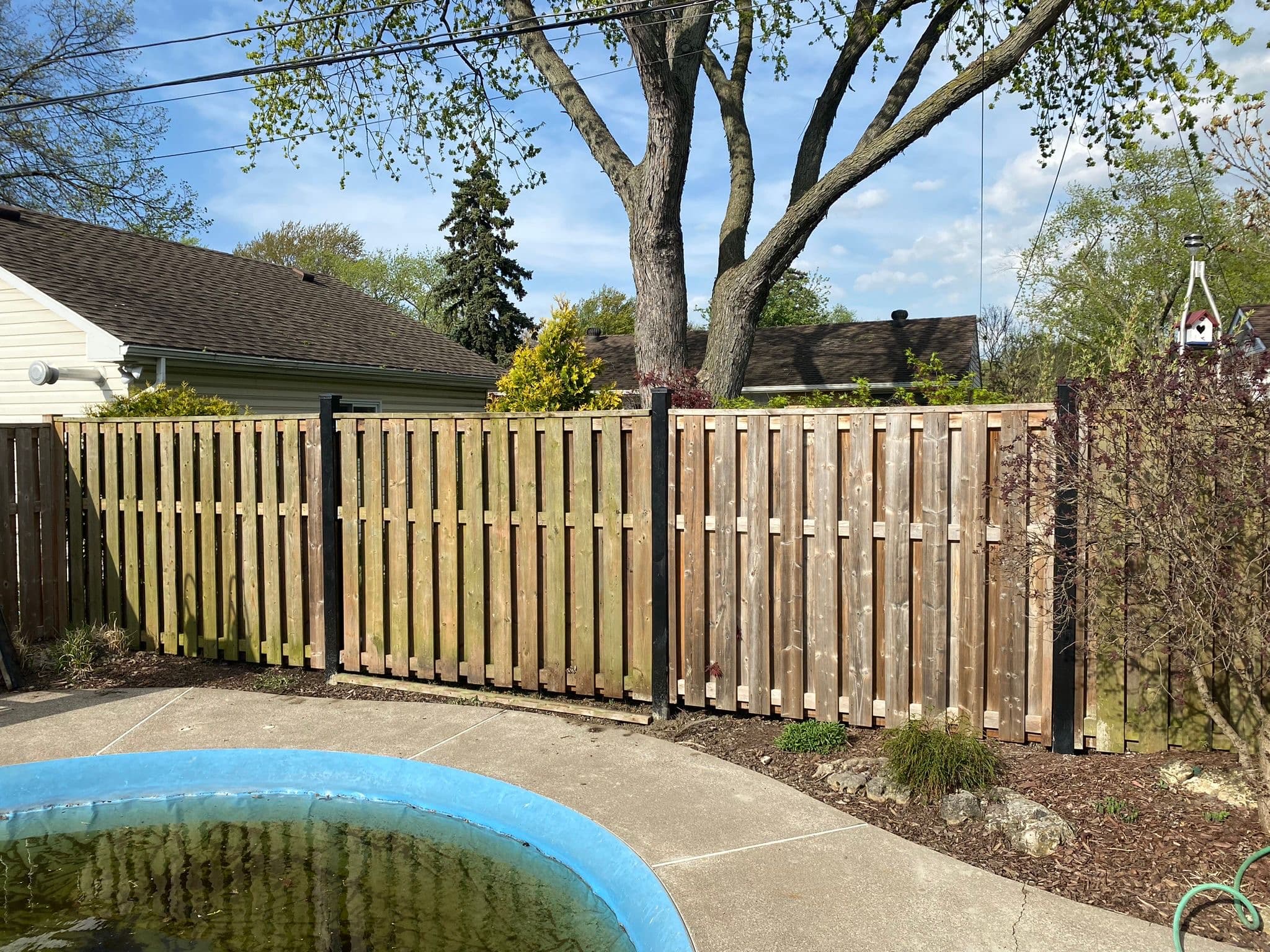 Weathered wood fence in pool area