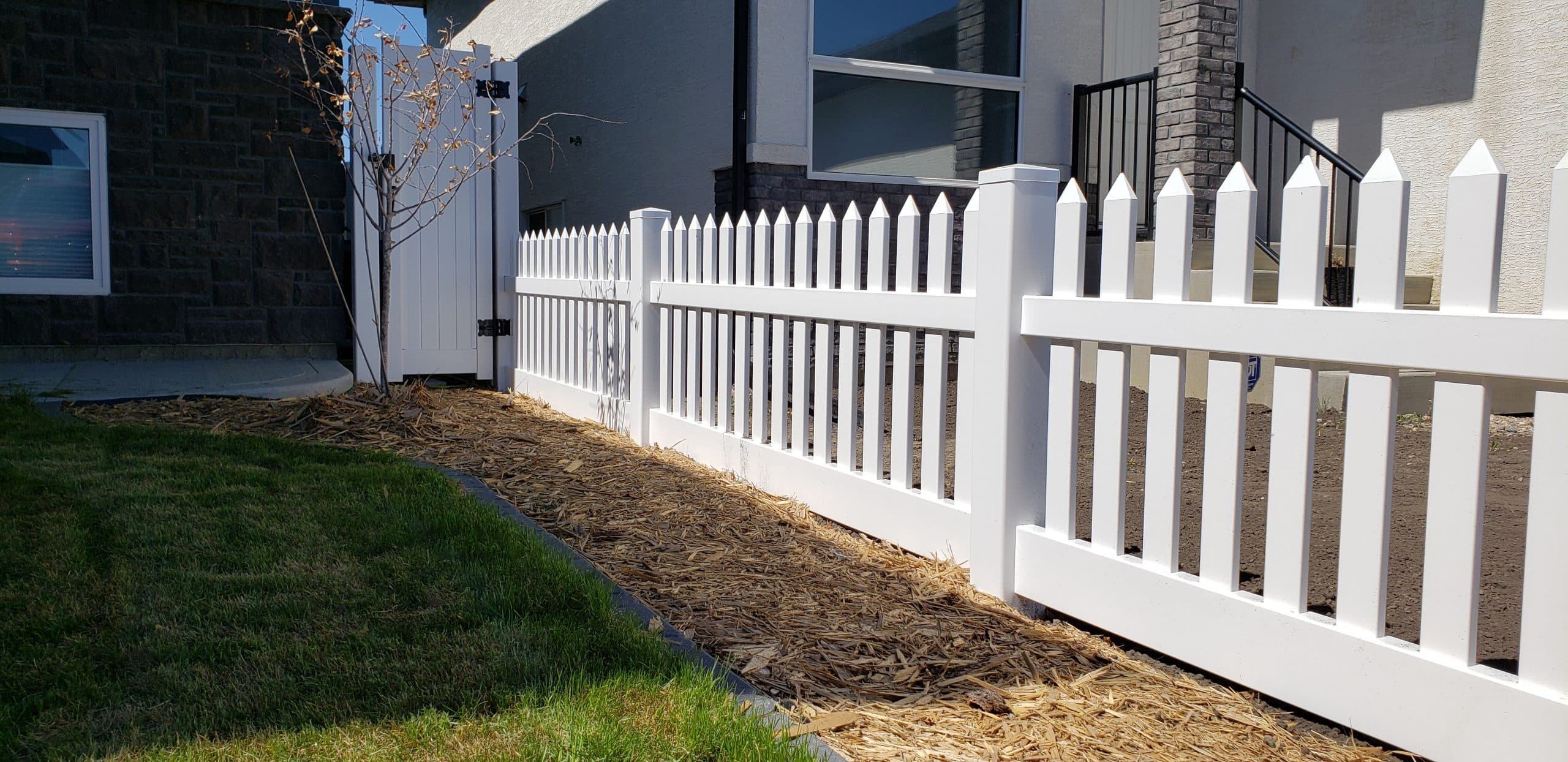 White vinyl picket fence with gate opening design