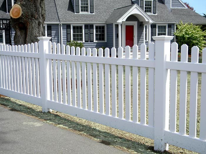 Tan vinyl privacy fence with traditional styling