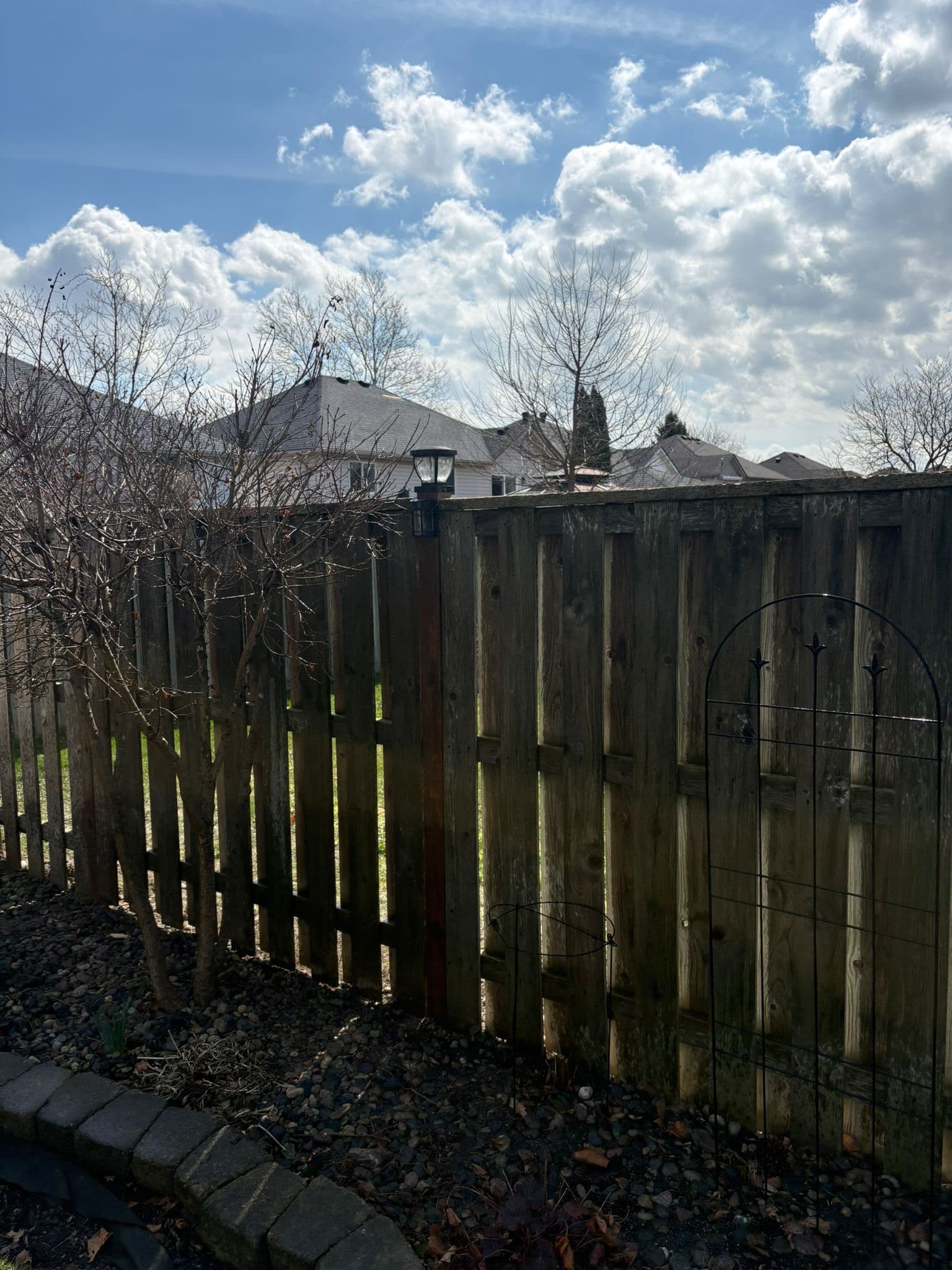 Aging wood fence with post deterioration